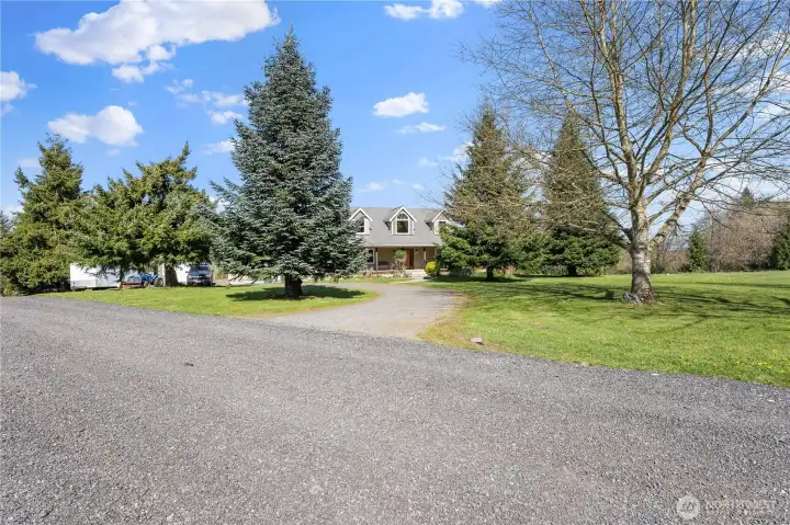 Mature trees at entry provide extra privacy and shade.