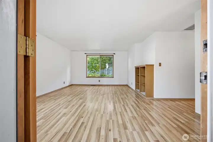 The rooms are spacious and the floors are laminate (over the original hardwood floors).