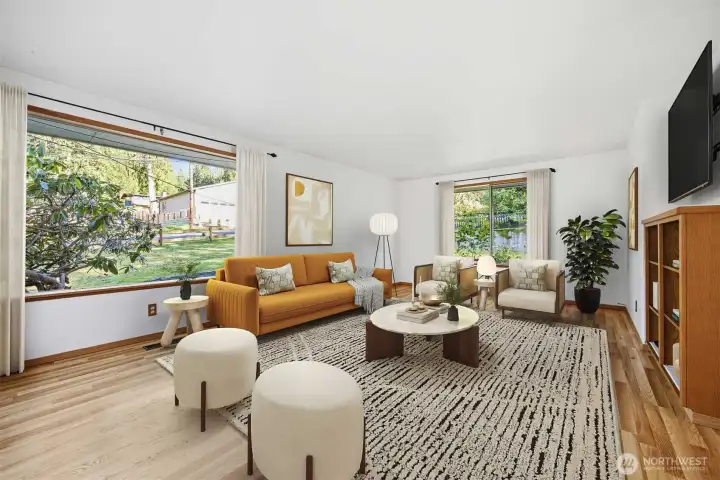 The living room is so spacious and the windows let in so much natural sunlight!