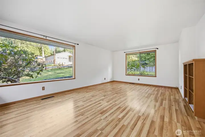The living room is so spacious and the windows let in so much natural sunlight!