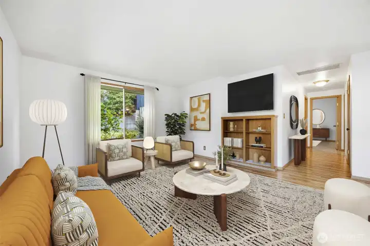 Looking across the living room with the hallway leading to the two bedrooms and the updated bathroom.