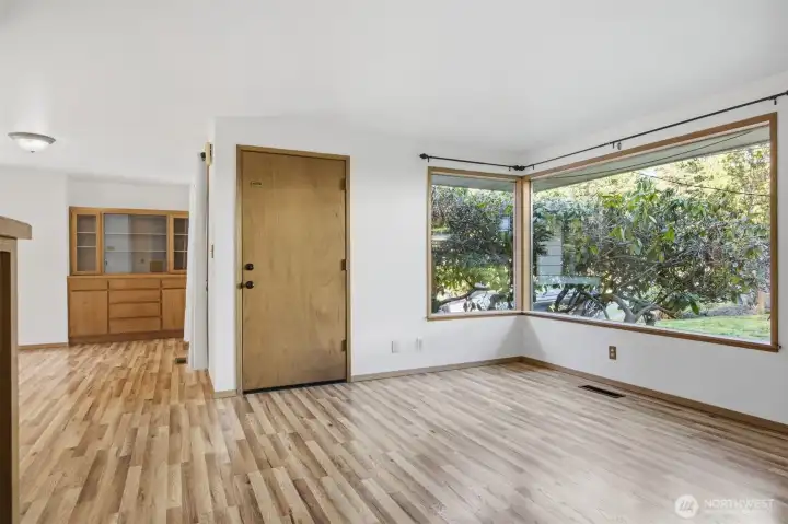 Another view of the large picture windows that take in the landscape views and fill the room with sunlight!