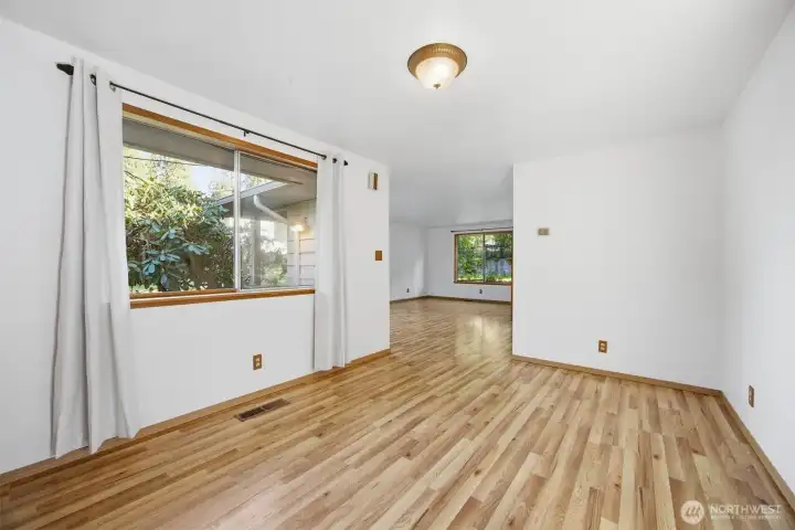 Looking from the spacious dining room toward the large living room beyond.