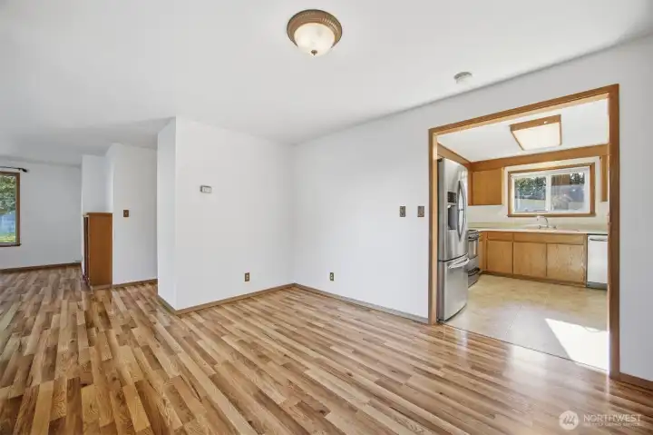 The kitchen is adjacent to the dining room and also filled with natural sunlight.