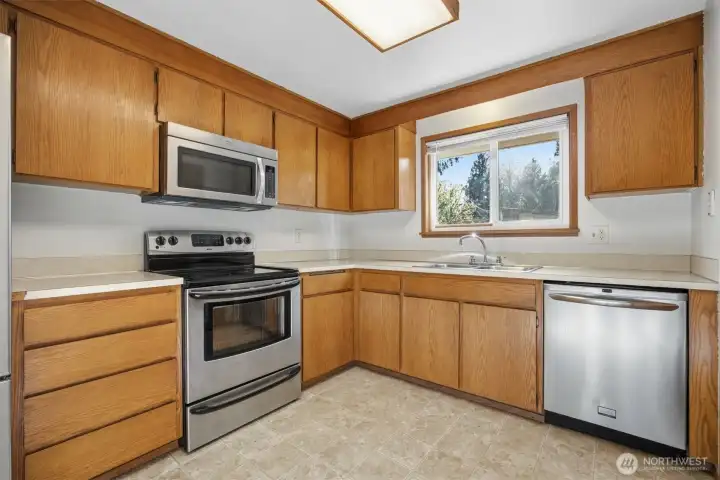 The kitchen has a great work triangle and the window above the kitchen sink looks to the rear yard.