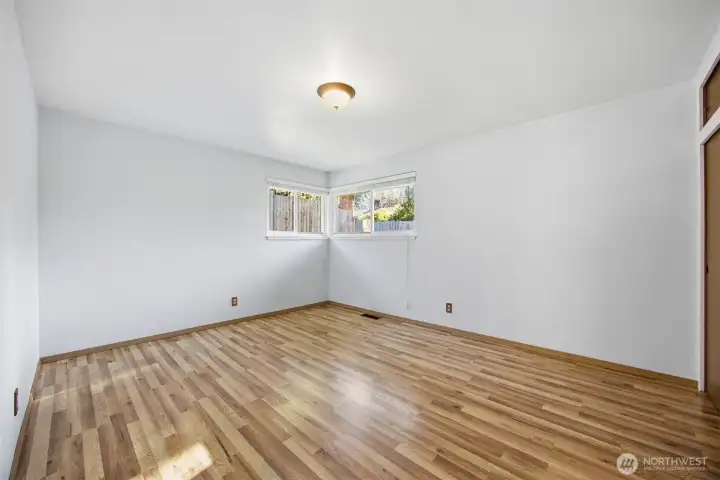 The primary bedroom is generously sized and looks to the rear yard.