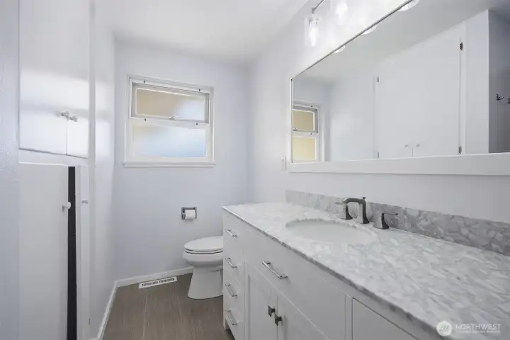 The storage space in the updated full bath is amazing as there is linen storage as well as vanity storage.