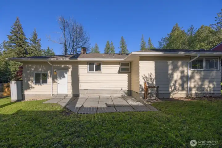 The back patio is just off the garage and perfect for BBQ's and gatherings as it is west-facing.