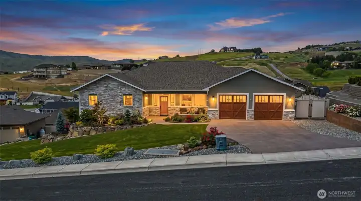 Custom single-level residence positioned to capture sweeping hillside and territorial views, offering a refined blend of craftsmanship, curb appeal, and elevated neighborhood presence