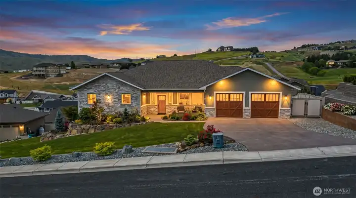 Custom single-level residence positioned to capture sweeping hillside and territorial views, offering a refined blend of craftsmanship, curb appeal, and elevated neighborhood presence