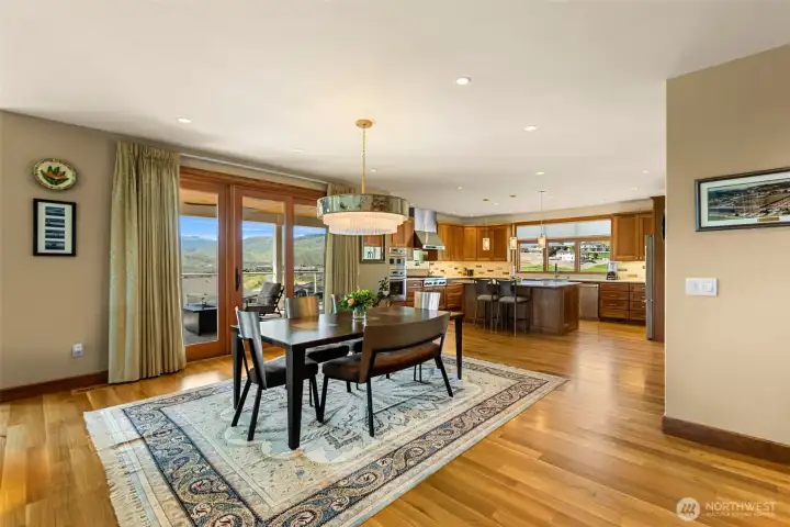 Rich white oak hardwood floors, custom cherry cabinetry, and expansive windows create a warm
