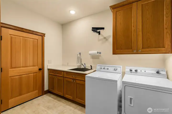 Functional and thoughtfully designed mudroom/laundry space