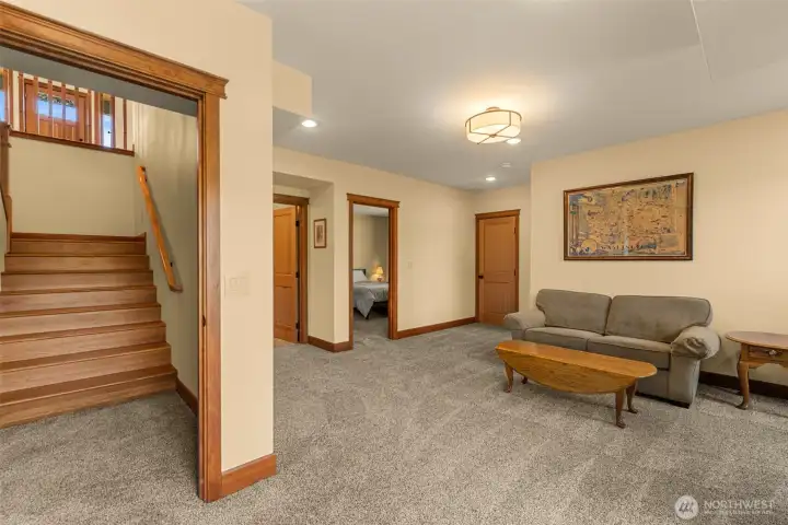Comfortable lower-level living area offering flexible space for a media room, recreation area, fitness space, or guest retreat.