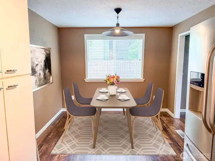 Dining room is conveniently located between the kitchen and second living room - Virtually staged Dining room is conveniently located between the kitchen and second living room - Virtually staged