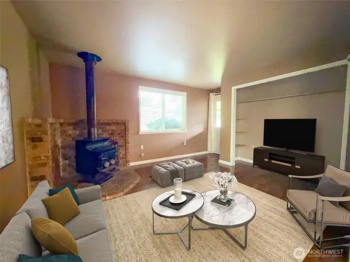 A second cozy living space anchored by a wood stove overlooks the private backyard - Virtually staged A second cozy living space anchored by a wood stove overlooks the private backyard - Virtually staged
