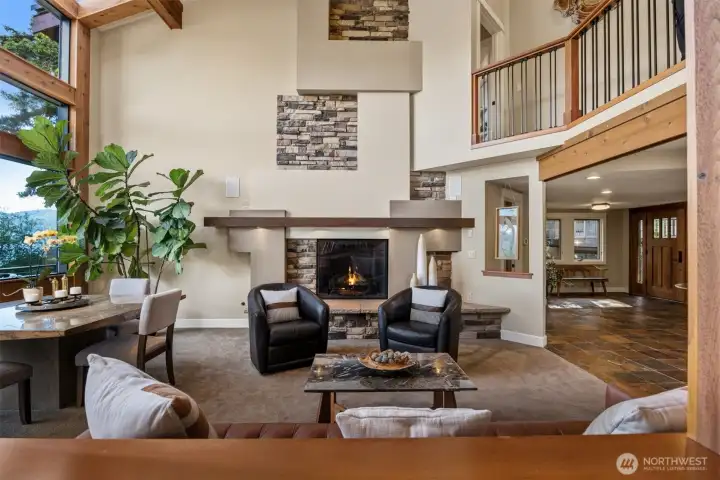 Custom-designed fireplace anchors living room.