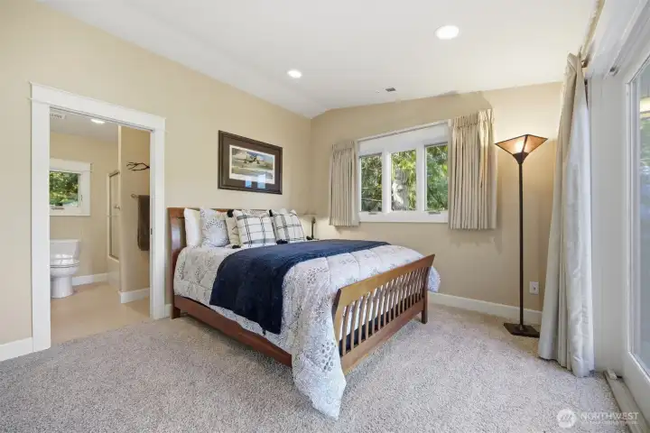 Bedroom with ensuite bath and walk-in closet.