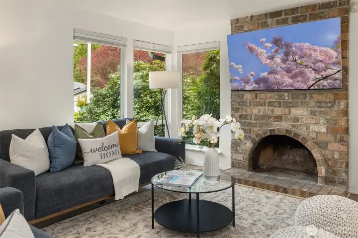 Windows have nice blinds and cozy wood fireplace- easily convertible to gas