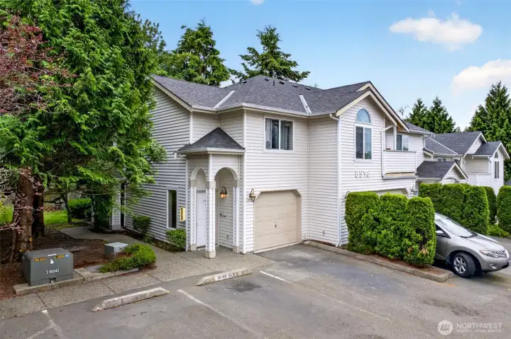 Tucked into a quiet, tree-lined pocket of the Somerfield community, this top-floor home greets you with mature landscaping, an attached one-car garage, and a welcoming arched entry. Easy guest parking and a private setting make every arrival and departure effortless.