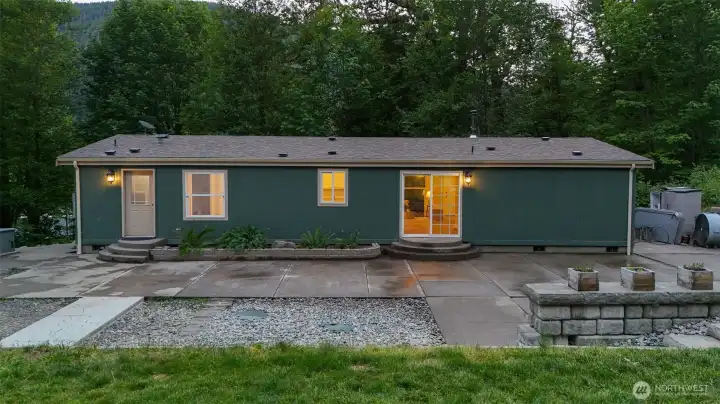 Large concrete patio creates the perfect space for outdoor entertaining, relaxing, or enjoying the peaceful natural surroundings. Large concrete patio creates the perfect space for outdoor entertaining, relaxing, or enjoying the peaceful natural surroundings.