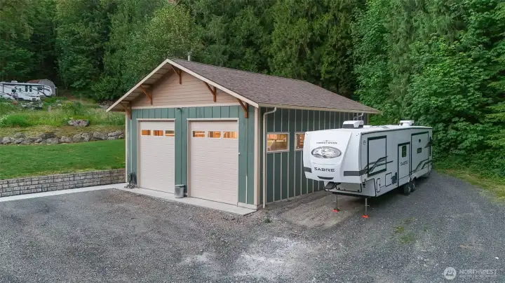 Oversized detached shop with additional covered parking and dedicated space for RV or trailer storage. Oversized detached shop with additional covered parking and dedicated space for RV or trailer storage.
