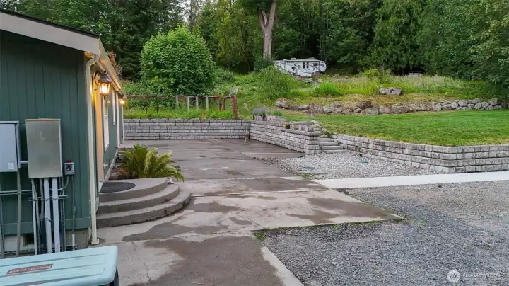 Beautiful retaining walls and terraced landscaping enhance both usability and curb appeal. Beautiful retaining walls and terraced landscaping enhance both usability and curb appeal.