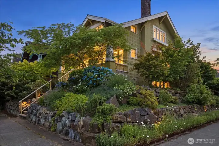 This 1914 craftsman sits high above the street on a corner lot