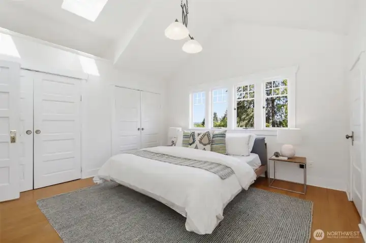 Primary bedroom on upper level with large closet spaces