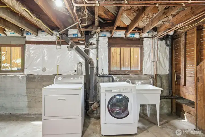 Main house laundry room in unfiinished basement