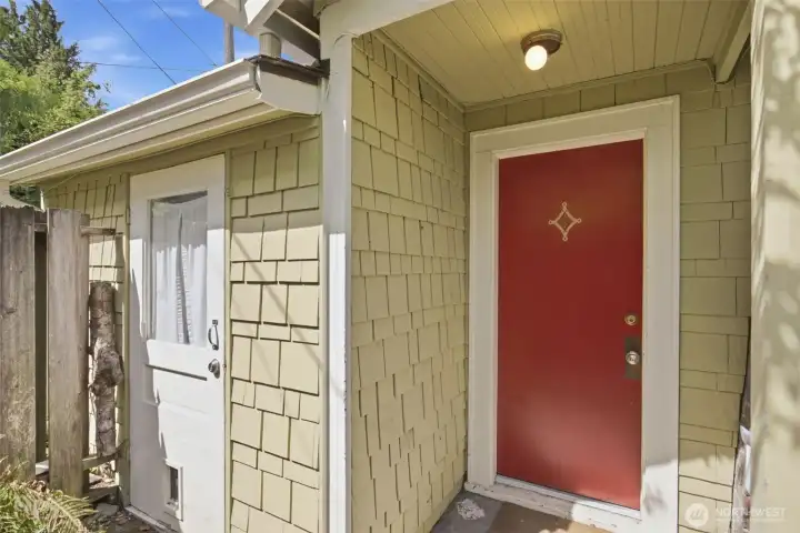 Second entrance to cottage with cottage laundry room to the left