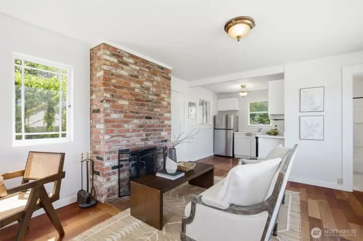 Cottage living and dining room with wood buring fireplace