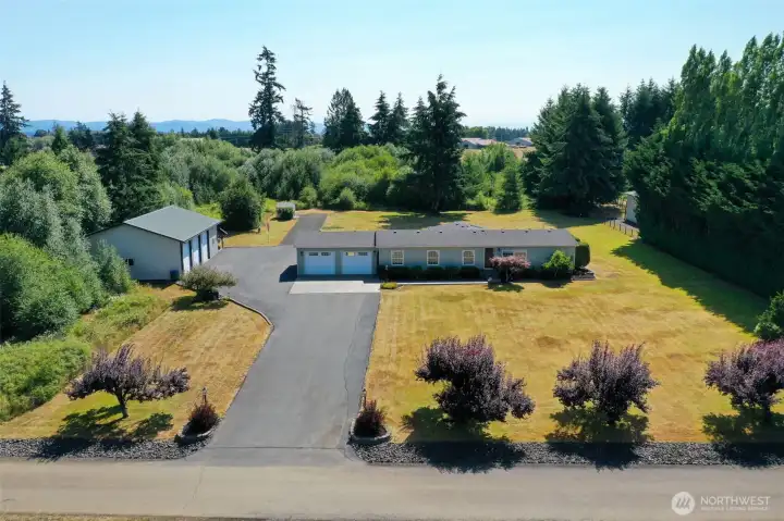 Thoughtfully planned out property with asphalt driveway, oversized 3 bay shop with tall doors, workspace and living area. Thoughtfully planned out property with asphalt driveway, oversized 3 bay shop with tall doors, workspace and living area.