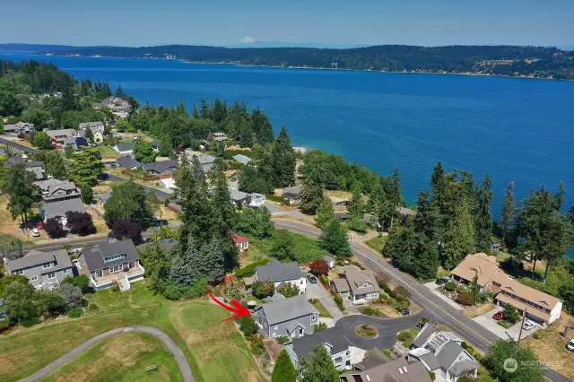 Perspective reflecting your proximity to Holmes Harbor & your wonderful neighborhood. Enjoy regular strolls & experience the friendliness of our South Whidbey community.  That is Mt. Baker, the snow capped mountain in the distance. Welcome to Whidbey!