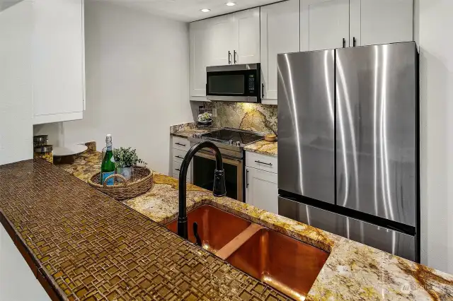 Kitchen is excellent, from the copper sink to the granite counters and newer cabinets and appliances; this is move-in ready.