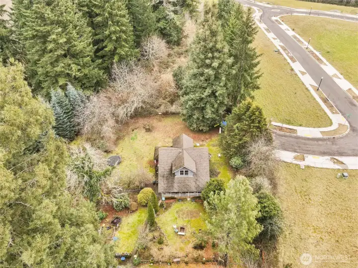 House front, with the new street to the right. (Possible available lot 1.36 acres to the left).