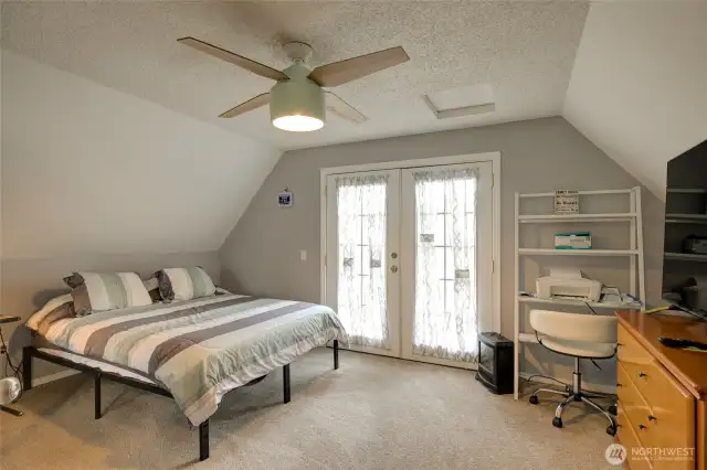 Upstairs bedroom, with balcony over looking back yard