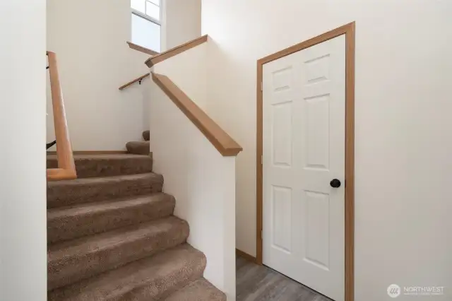 Stairs lead to 3 more bedrooms.