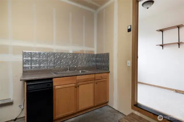 2 car garage with sink and dishwasher.