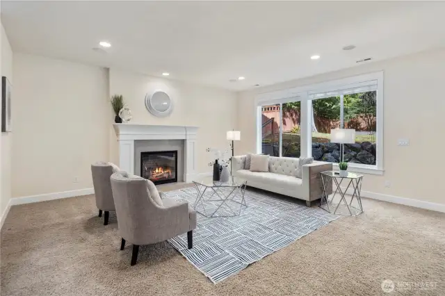 The spacious and inviting family room with a cozy gas fireplace to enjoy time!
