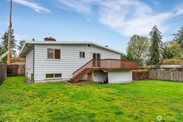 Deck off kitchen and more storage under the deck.  This home has storage galore.