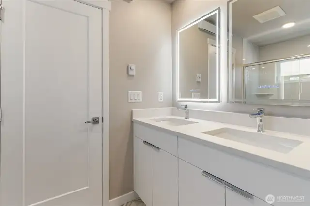 Primary ensuite has back lit mirrors