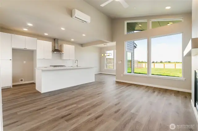 Lots of natural light coming in through the large windows.
