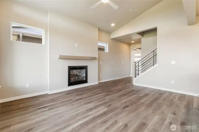Stairs in foreground of Living area lead to upstairs.