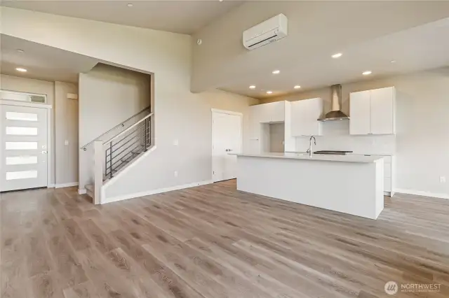 Drop ceiling in the kitchen with ample can lighting.