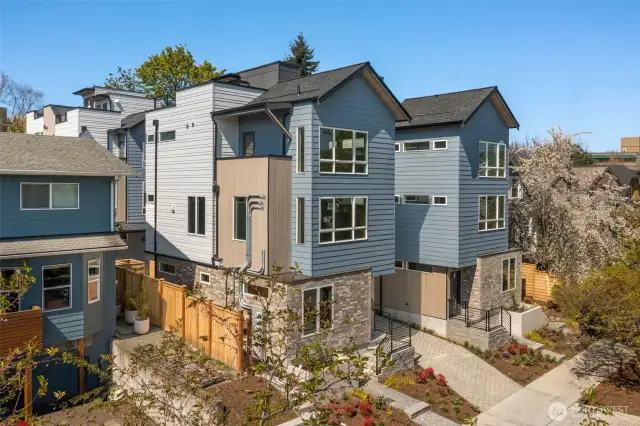 Welcome to the Capitol Pines Collection — where sleek modern design meets timeless Northwest charm. These striking homes make a statement from the curb with bold symmetry, crisp lines, and a central walkway that sets the tone for something unique.