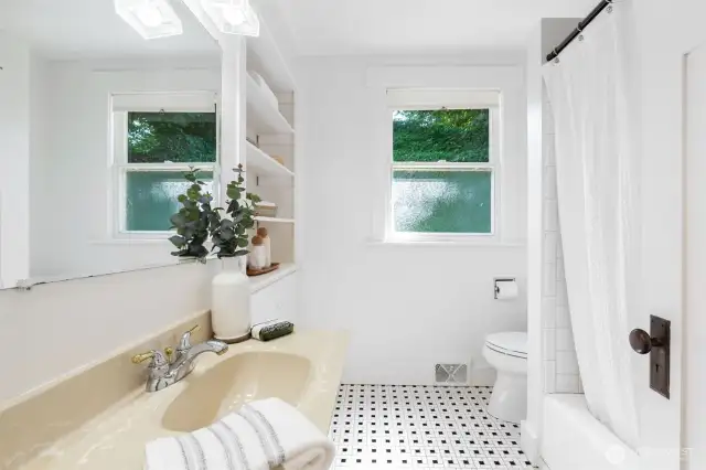 One of two full bathrooms, this one is on the main floor, adjacent to the bedroom.