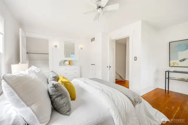 This spacious bedroom features two closets plus a built-in dresser.