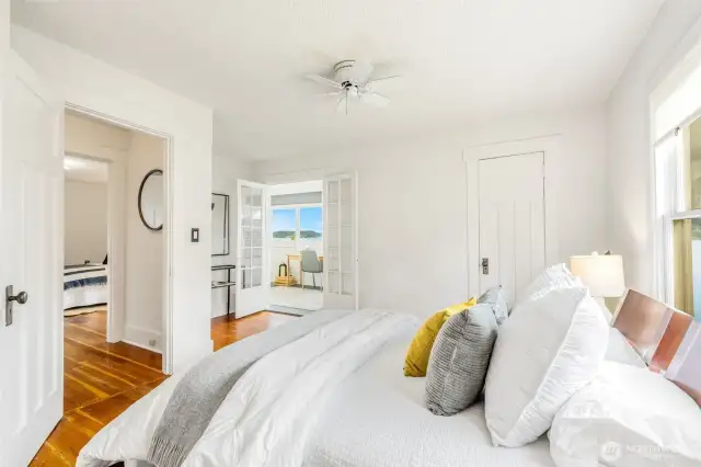 French doors lead to the sweet dormer room.
