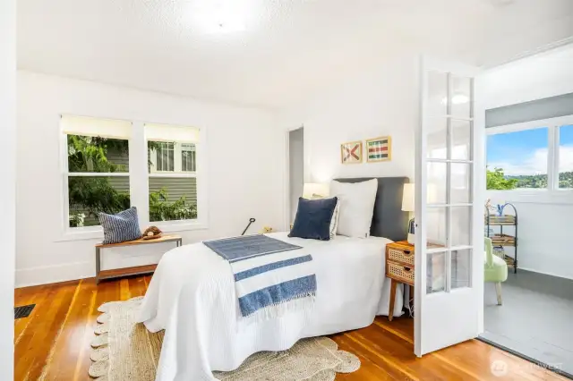 The third bedroom, one of two upstairs, also has French doors opening to the dormer room.