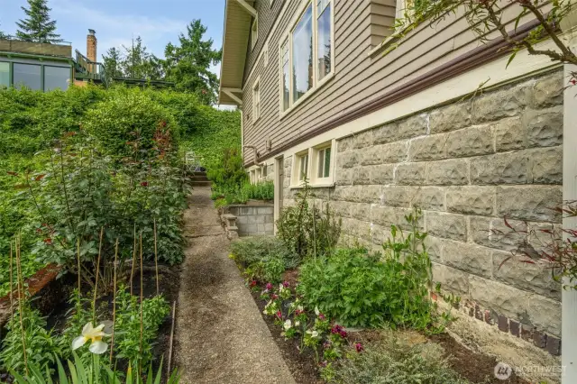 The southern side yard is a great place for herbs and edibles.